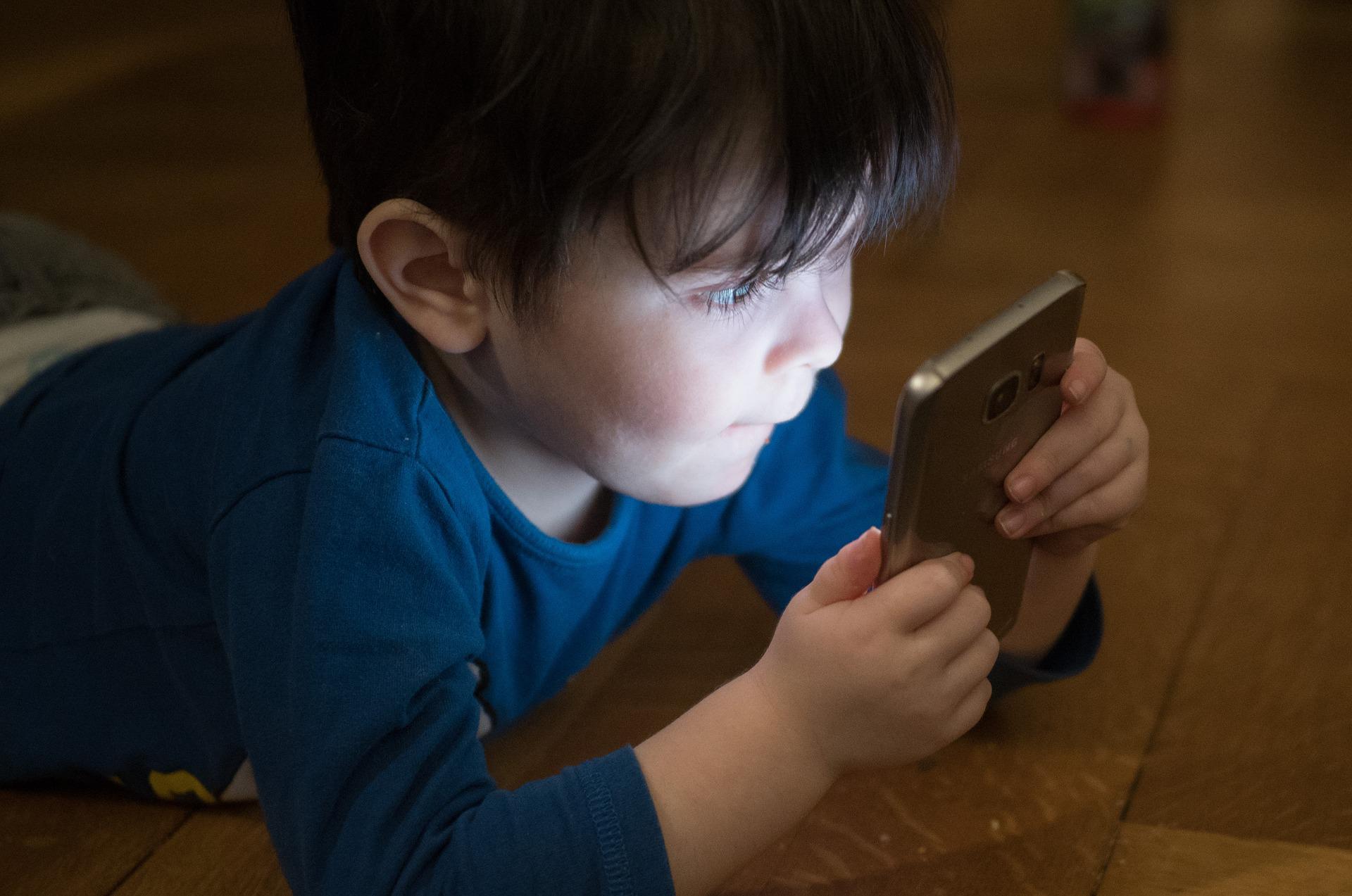 Boy with first mobile phone