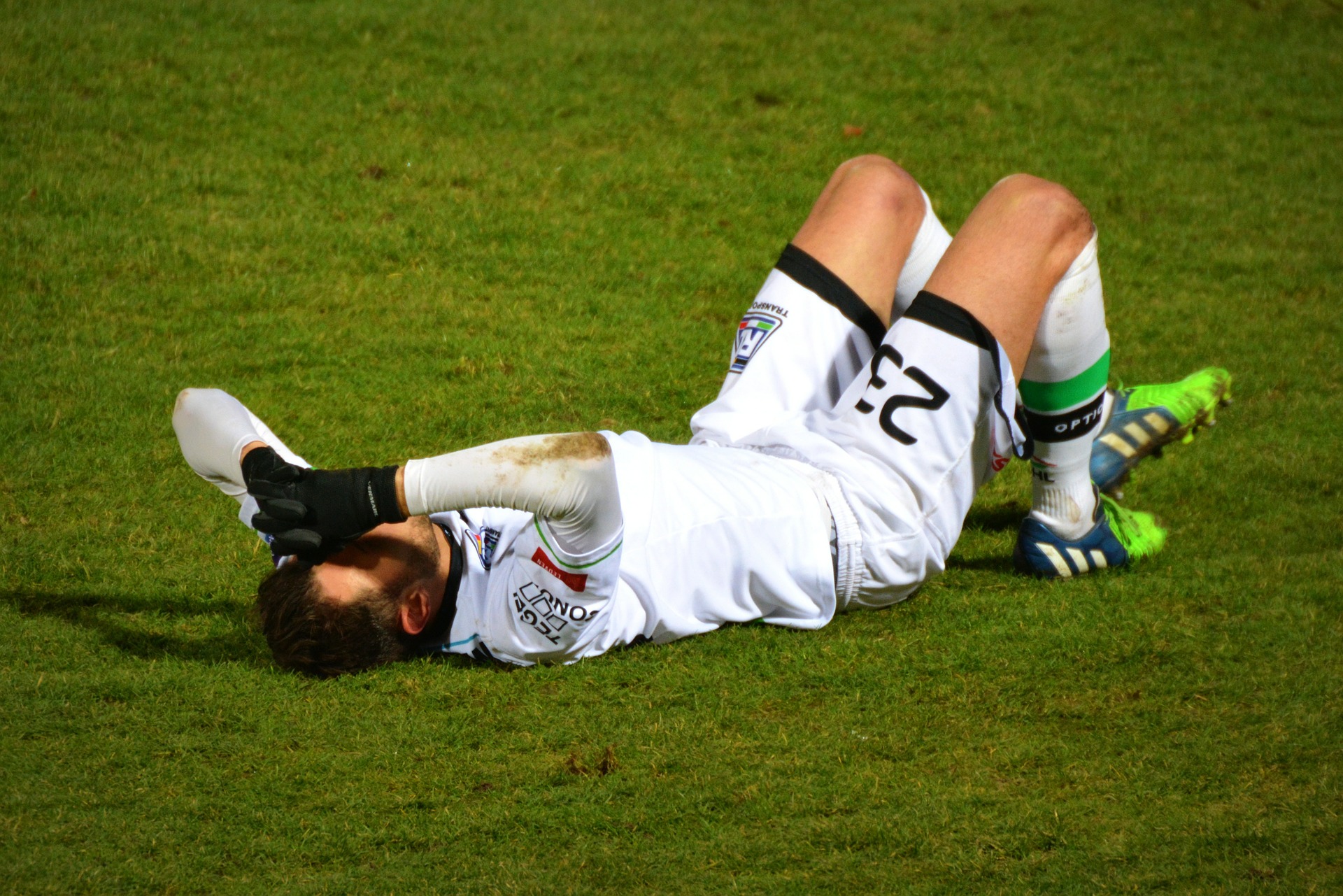 Prevent Sporting Injuries man playing football injured on the ground