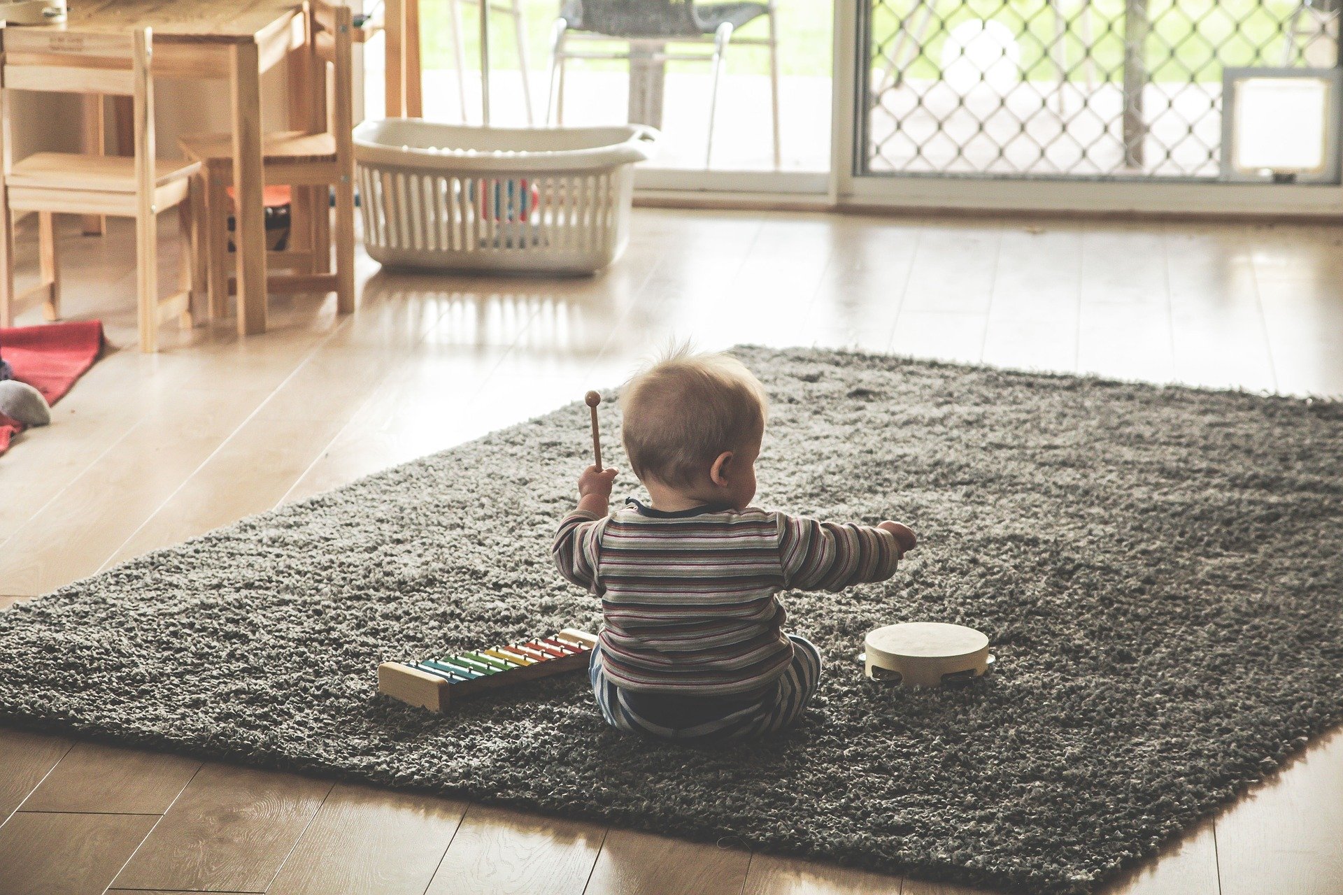Child playing with various instraments