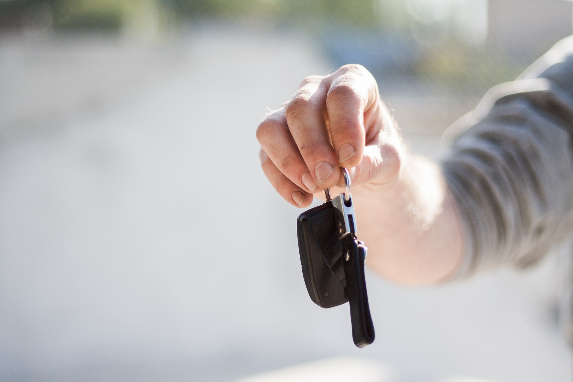 set of car kets held in a hand for Behind The Wheel