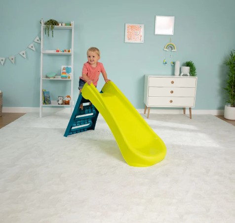 Child playing on a slide for imaginative play
